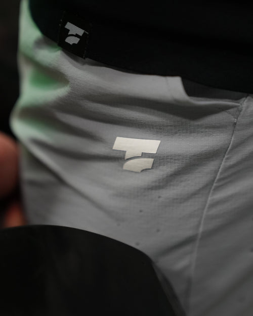 Close-up of Gray Shorts with Temple Fitness Logo