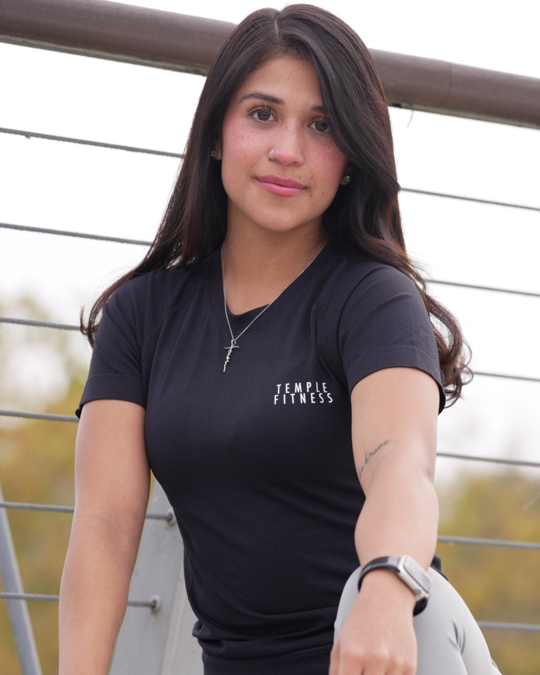 Woman sitting on a chair with a blurred outdoor background